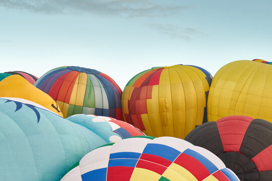 Flurry of hot air balloons taking off at a festival