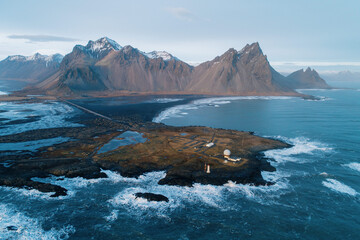 Aerial shot of Stokksnes beach and Vesturhorn mountain in winter, Southeast Iceland.