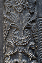 the decorative ornament on the stone of the old building
