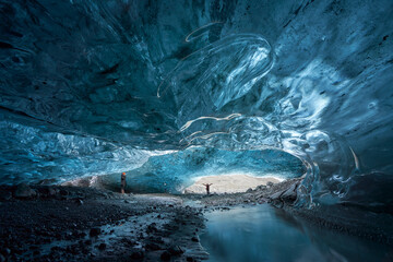 Tourists exploring an Ice Cave in Breiðármerkurjökull outlet glacier, Vatnajökull National...