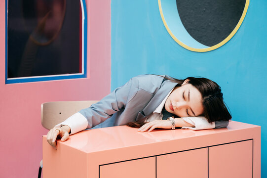 Young and fashionable asian girl having a rest in city