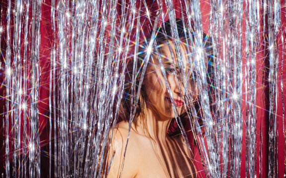 Classy woman among silver tinsel