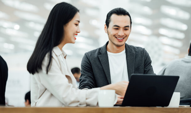 Businessman and businesswoman working on a computer