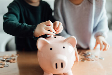 Family saving money in a piggybank