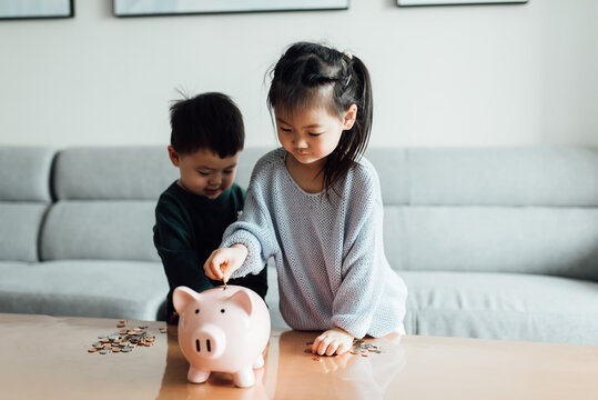 Family saving money in a piggybank