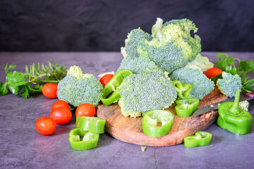 Organic fresh broccoli with pepper and tomatoes cherry, cut and prepare for cooking.