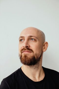 Bald smiling man studio portrait