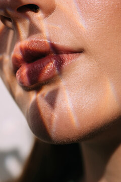 Crop model with crystal shadow on lips