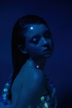 Dreamy mermaid in blue light