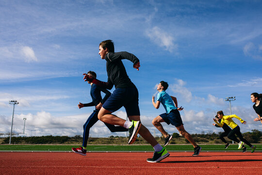 Teenagers running race on stadium