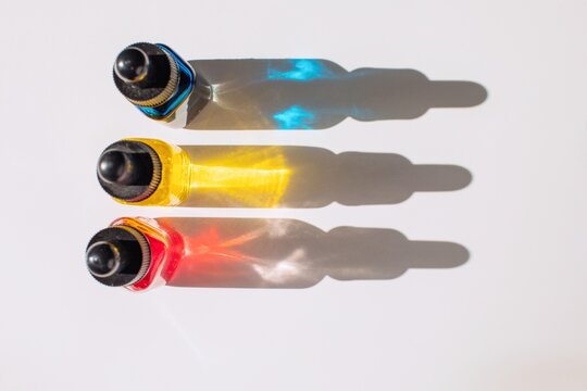 Small bottles with colorful liquids
