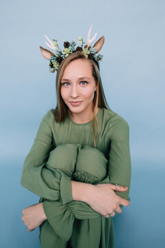 Lovely girl in deer horns headdress