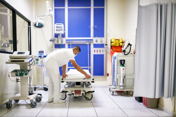 Medical professional is preparing an ICU bed