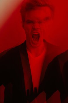 Screaming young man red portrait