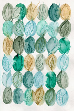 Green and ochre leaves on white paper
