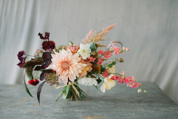 Flower bouquet against grey cloth background with copy space