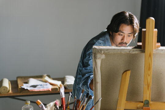 Male artist woking in studio