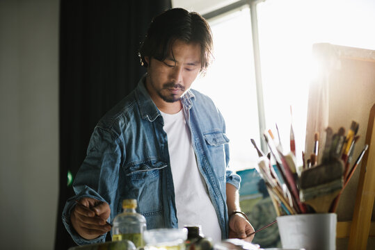 Male artist woking in studio