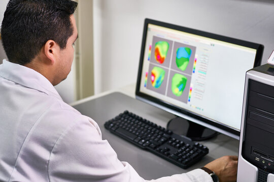 Scientist analyzing medical scanner imagery