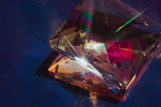 Shining crystal on violet background