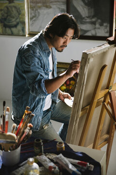 Male artist woking in studio