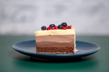 chocolate cake with strawberry and pomegranate seeds