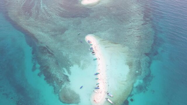 Aerial view footage of beautiful Sandbank island in clear turquoise blue ocean water at the Island of Redang, Terangganu Malaysia