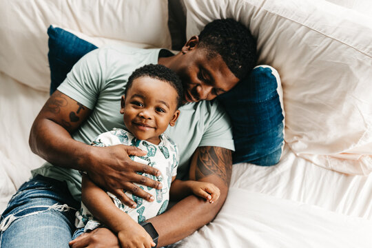A father and son embracing.