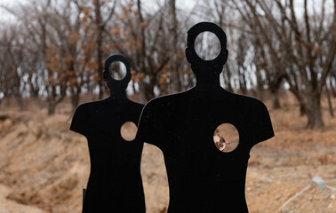 Human targets in autumn countryside