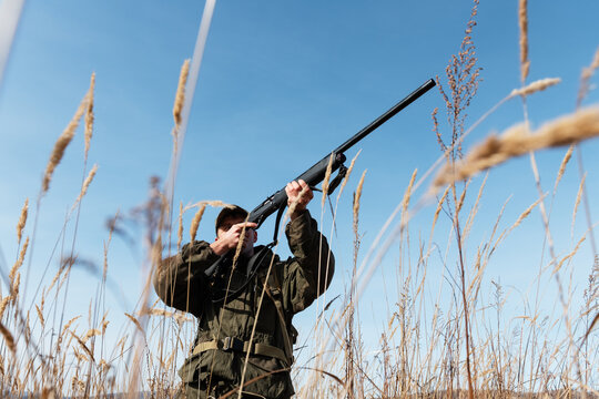 Man hunting against cloudless sky