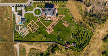 Aerial view over a large upscale luxury house in the suburb on a sunny summer day. Canada.