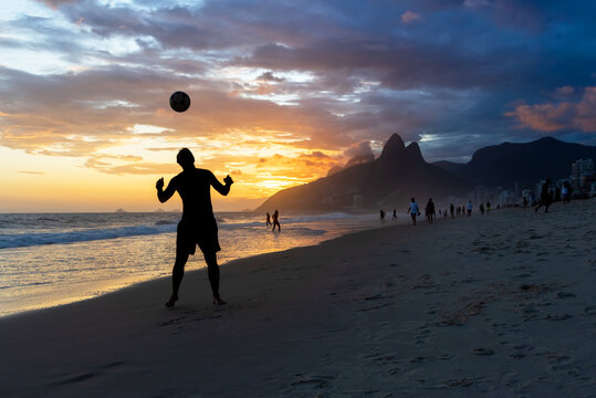 Man playing soccer in Ipanema Beach