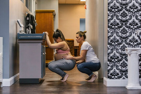 Doula Working with Expecting Mother Birthing Clinic