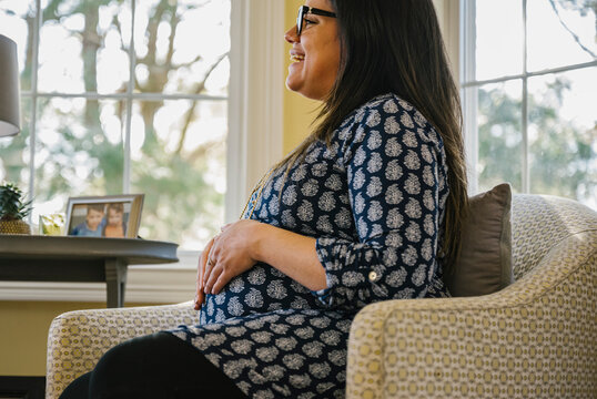 Portrait of Happy Smiling pregnant Hispanic Mother