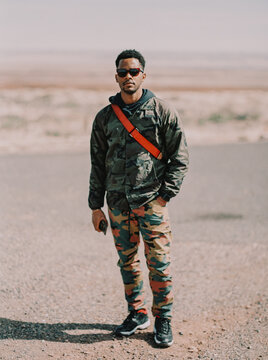 Portrait of a man exploring a dry canyon plateau in Arizona