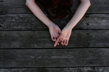 Woman lying on wooden floor