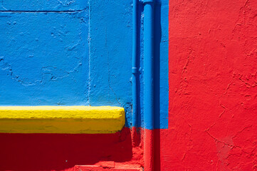 Detail of a yellow, blue and red wall in Caminito Street, Buenos Aires
