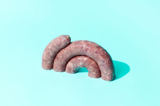 half coil of uncooked pork meat sausage
