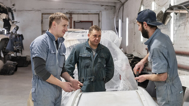 Male technicians talking during break