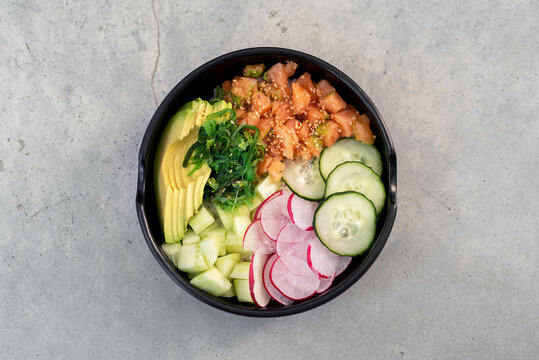 Raw fish and vegetables poke bowl