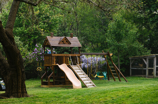 Swing Set in Backyard in Summer