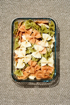 cooked farfalle in a glass container