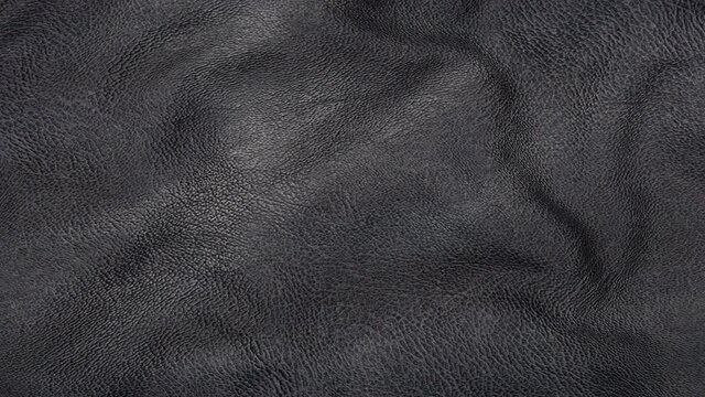 animated black leather background. a piece of black leather with folds. 3d render