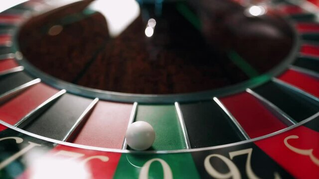 Casino roulette in motion, the spinning wheel ball