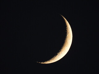 Obraz na płótnie Canvas Bright Quarter Crescent Moon in Black Dark Sky 