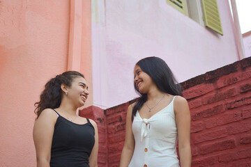 happy friends smiling staring at each other