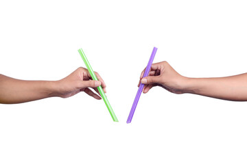Two hands holding big drinking green and purple straws isolated on white background.