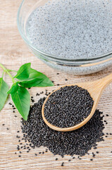 Law Hairy basil or Lemon basil seeds in wooden spoon.