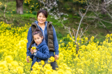 Mother & daughter in spring flowers