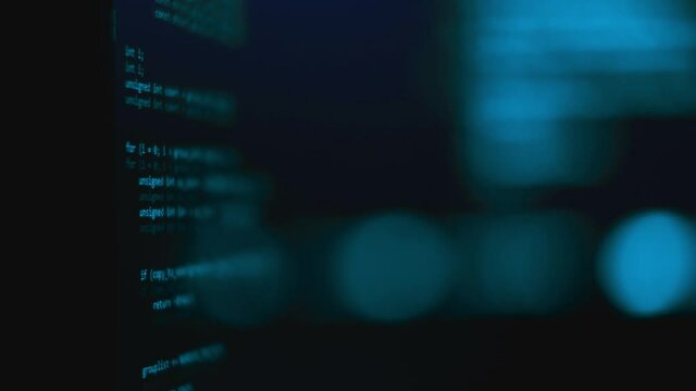 Modern tech. Program development and blockchain concept. Developer working on program codes in office. Shallow depth of field bokeh, selective focus effect. Hacking or protection data